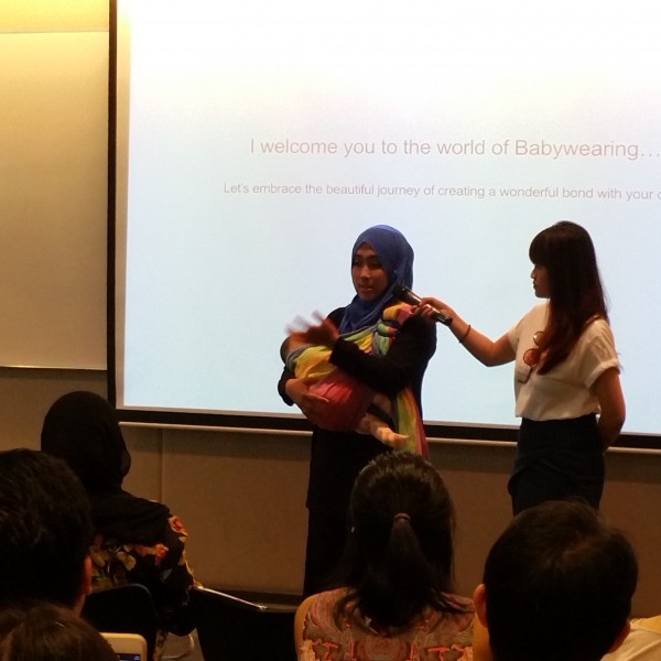 Consultant from CareRing Sling explaining how to babywear & breastfeed